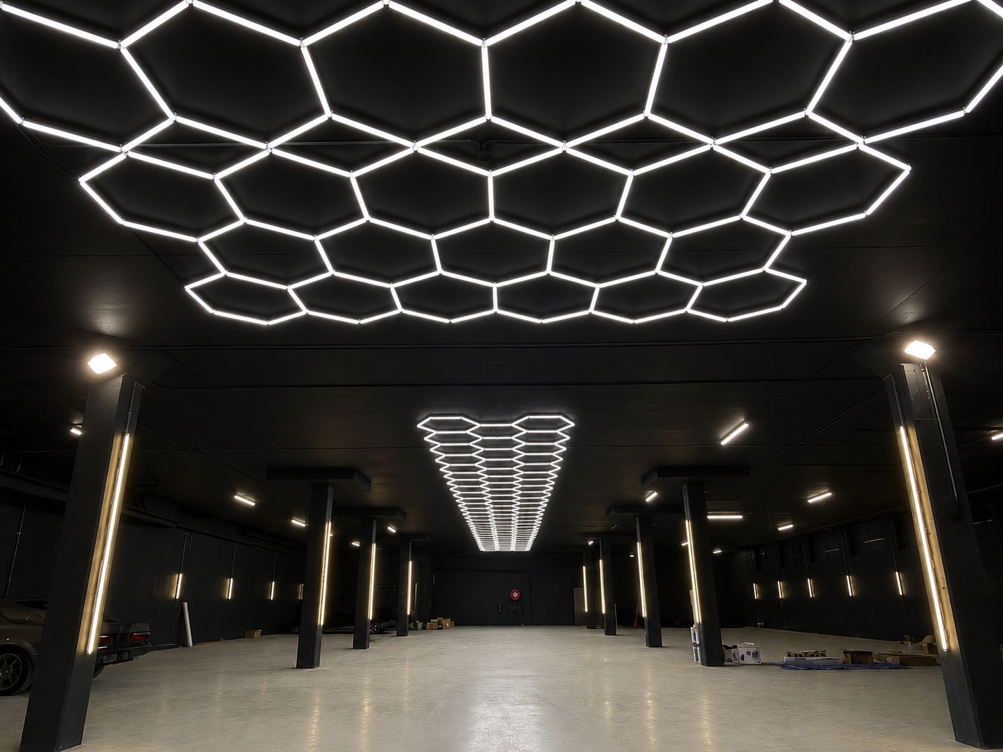 Hexagonal LED feature lighting installed by Sparky Bros across a commercial warehouse ceiling
